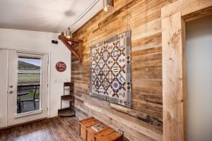 Custom wood worked wall and industrial decor in the grand canyon train house in Williams, Arizona